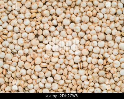 Uncooked raw quinoa background Stock Photo