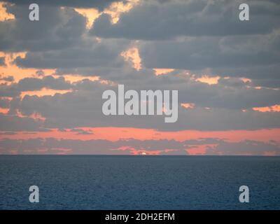 Sun disc over the sea at sunset Stock Photo