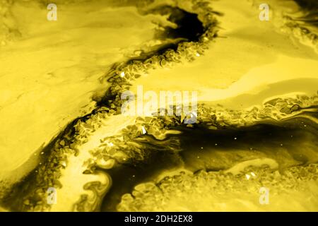 Abstract background. Abstract hand painted yellow and grey with gold background, close-up of acrylic painting. Wallpaper, texture. Stock Photo