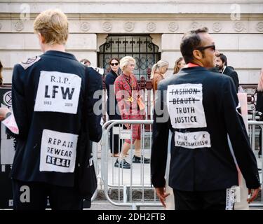 London, United Kingdom - September 15, 2019: Extinction Rebellion outside London Fashion Week to raise awareness on the climate impact of fashion Stock Photo