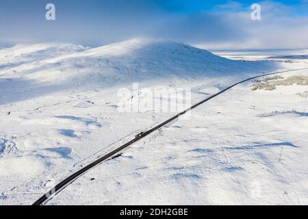 Aerial view of A82 road crossing Rannoch Moor covered in snow during winter, Highlands,Scotland, UK Stock Photo