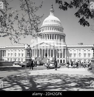 1960s, historical, exterior view from this era of the east front of the Capitol building, Washington DC, USA. The seat of the US Congress, the legislative branch of the Federal government, the neonclassical building, completed in 1800, is located on Capitol Hill on National Mall. Stock Photo