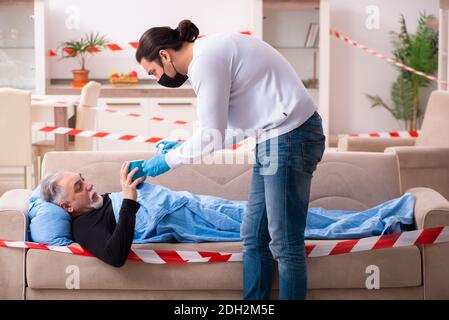 Father and son in coronavirus disease concept at home Stock Photo