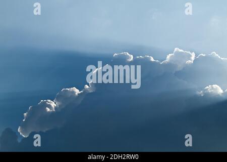 Sunlight shining through layers of clouds Stock Photo