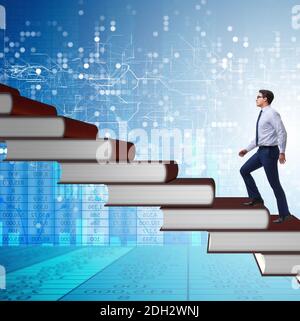 Businessman student climbing the ladder of education books Stock Photo