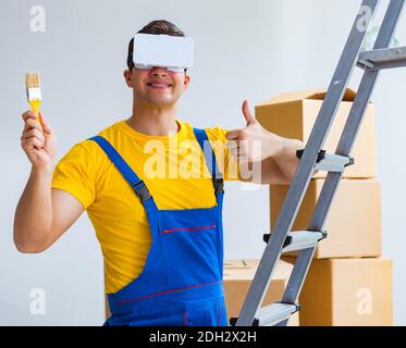 Painter contractor working with virtual reality goggles Stock Photo