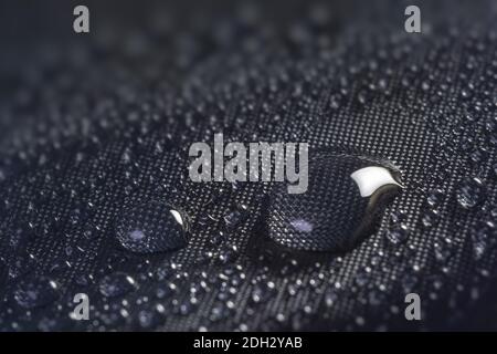 Many water drops on waterproof impregnated fabric. Stock Photo