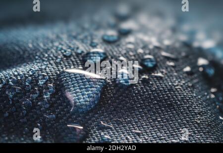 Many water drops on waterproof impregnated textile. Stock Photo