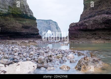 Misty morning fog landscape on the cliffs of Etretat in France Stock Photo