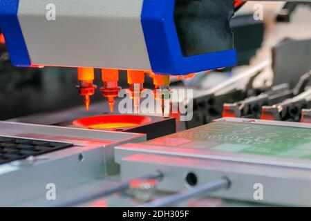 Process of selective soldering components to printed circuit boards at factory Stock Photo