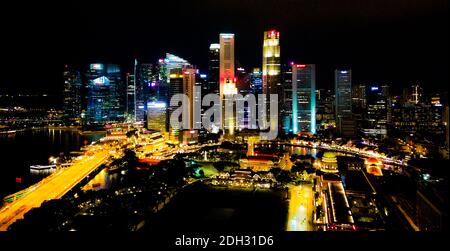 SINGAPORE - May 6, 2017: Nighttime aerial panorama across the Singapore bay toward the Financial and Business District. Stock Photo