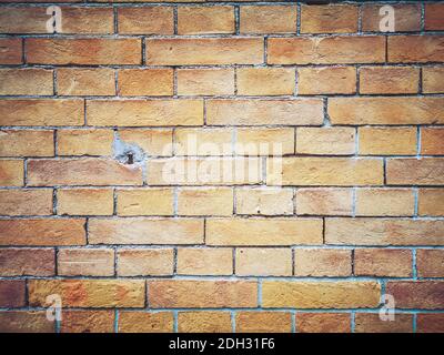 Brick wall background. Brown and red bricks, masonry texture of a building exterior Stock Photo