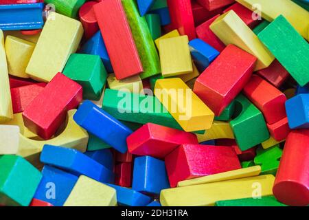 Playing with wooden toy blocks in kindergarten or preschool Stock Photo