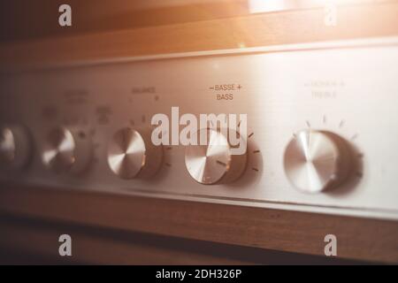 Silver wooden vintage amplifier: Close up of control knobs Stock Photo