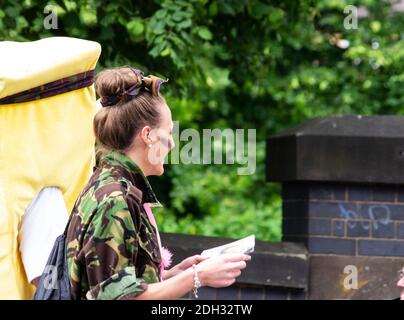 Young girl wearing an army jacket Stock Photo