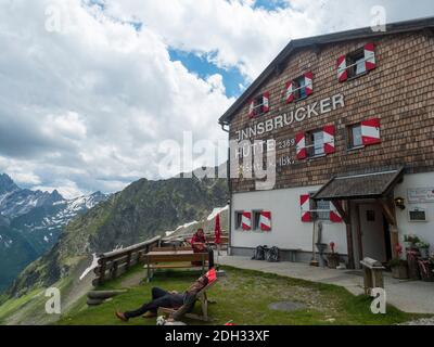 Stubai Valley, Innsbruck-Land, Tirol, Austria, July 6, 2020: hiker people resting at terrace of Innsbrucker Hutte, an alpine mountian hut at summer Stock Photo