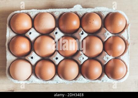 Eggs in a basket for morning breakfast or baking a cake, top view. Stock Photo
