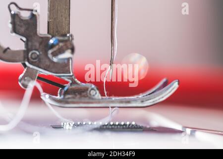Sewing at home: Close up picture of sewing needle Stock Photo