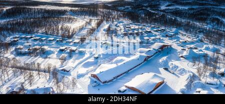 Scenic aerial view on snow covered Swedish Norwegian camping in Tarna Vilt village in Lapland, close to state border, Joesjo, Sweden, Scandinavian mou Stock Photo