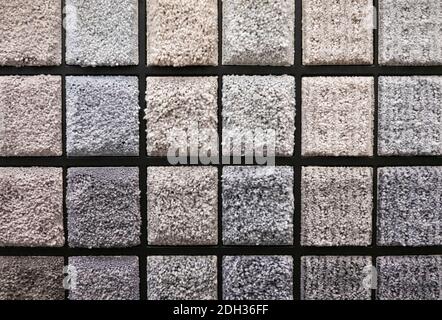 Variety of carpet texture samples displayed on a textured board showcasing multiple shades and styles in a modern showroom Stock Photo
