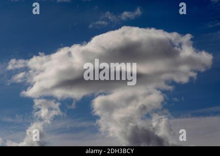 Cumulus clouds filled with moisture float over the American Southwest. Stock Photo