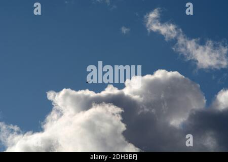 Cumulus clouds filled with moisture float over the American Southwest. Stock Photo