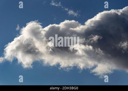 Cumulus clouds filled with moisture float over the American Southwest. Stock Photo