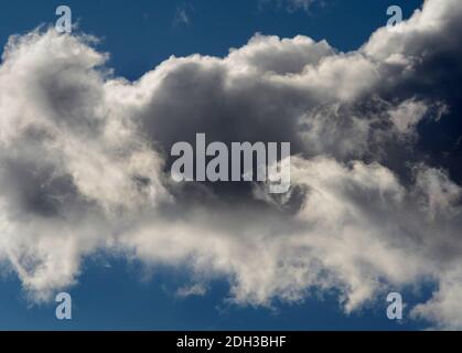 Cumulus clouds filled with moisture float over the American Southwest. Stock Photo