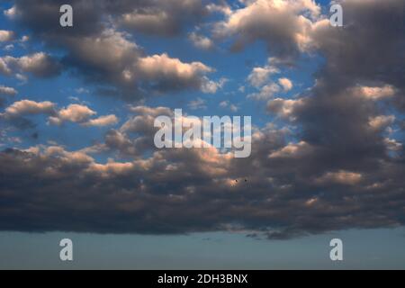 Cumulus clouds filled with moisture float over the American Southwest. Stock Photo