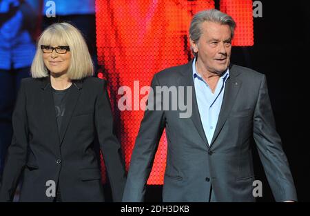File photo - Alain Delon and Mireille Darc appearing on France 3's TV show 300 Choeurs Pour La Vie in La Plaine St-Denis, near Paris, France on September 24, 2012. Darc died at 79 it was announced today. She was Alain Delon's longtime co-star and companion. She appeared as a lead character in Jean-Luc Godard's 1967 film Week End. Photo by Giancarlo Gorassini/ABACAPRESS.COM Stock Photo