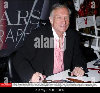 File photo - © Darla Khazei/ABACA. 53446-2. New York City-NY-USA, December 3, 2003. Hugh Hefner takes Manhattan with new opening of the new Bunny Boutique at the Henri Bendel Store on Fifth Avenue. He also signed copies of his new book 50 Years: The Photographs. Stock Photo