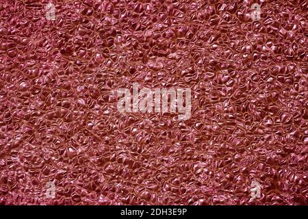 Texture of polystyrene plastic close up, burgundy color. For background, design with copy space text or image Stock Photo