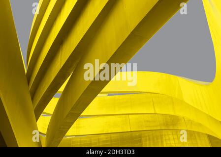 Futuristic urban backdrop. Art arch triangles made of metal in yellow color on grey background. Textured Bright yellow and grey abstract waved Stock Photo