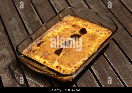 Traditional South African bobotie on a table. This photo has selective focus. Stock Photo