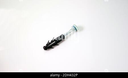 Close-up - dowel and self-tapping screw in a black case Stock Photo