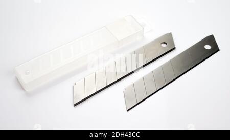 Construction blade.Complete with a plastic case.On a white background.Construction knife isolate. Stock Photo