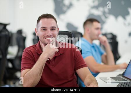 Two male software developers working on computer Stock Photo