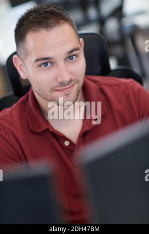 Casual business man working on desktop computer Stock Photo