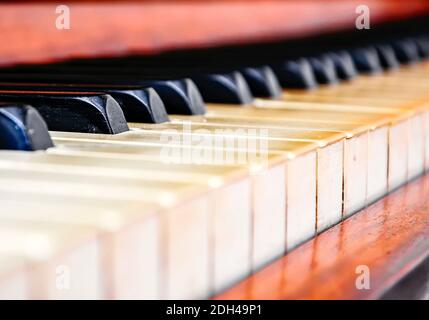 Close up of the keys of an old worn piano. Music and musical instruments Stock Photo