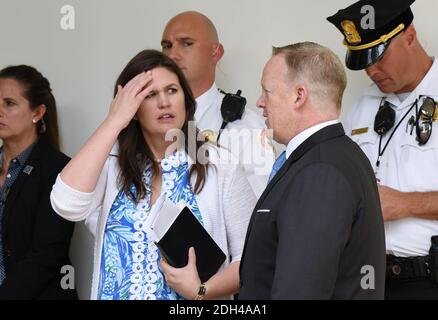 Outgoing press Secretary Sean Spicer talks with Principal Deputy Press Secretary Sarah Sanders during a press conference in the Rose Garden of the White House on July 25, 2017 in Washington, DC. . Photo by Olivier Douliery/ Abaca Stock Photo