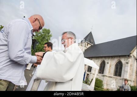 A man is given communion during a mass marking the first anniversary of the killing of French Catholic priest Jacques Hamel by two jihadists at his church in Saint-Etienne-du-Rouvray, in Normandy, northern France on July 26, 2017. Photo by Eliot Blondet/ABACAPRESS.COM Stock Photo