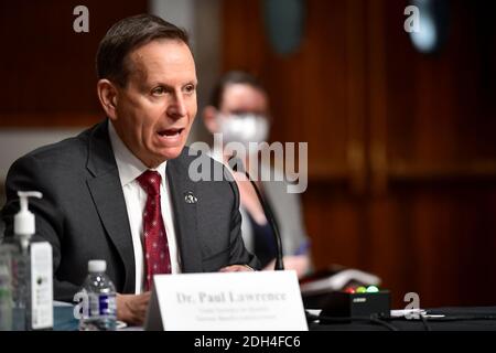 Washington, United States Of America. 09th Dec, 2020. Dr. Paul R. Lawrence, Under Secretary for Benefits, Veterans Benefits Administration, U.S. Department of Veterans Affairs, appears before a Senate Committee on Veterans Affairs hearing to examine the Department of Veterans Affairs response to COVID-19 across the VA enterprise in the Dirksen Senate Office Building on Capitol Hill in Washington, DC, Wednesday, December 9, 2020. Credit: Rod Lamkey/CNP | usage worldwide Credit: dpa/Alamy Live News Stock Photo