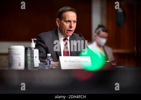 Washington, United States Of America. 09th Dec, 2020. Dr. Paul R. Lawrence, Under Secretary for Benefits, Veterans Benefits Administration, U.S. Department of Veterans Affairs, appears before a Senate Committee on Veterans Affairs hearing to examine the Department of Veterans Affairs response to COVID-19 across the VA enterprise in the Dirksen Senate Office Building on Capitol Hill in Washington, DC, Wednesday, December 9, 2020. Credit: Rod Lamkey/CNP | usage worldwide Credit: dpa/Alamy Live News Stock Photo