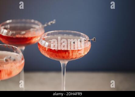 Glasses with cold pink champagne placed on table Stock Photo