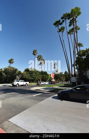 The city of Los Angeles is testing a unique grey substance designed to keep roads cooler by 11F-13F. The $150,000 pilot project in 15 council district aims to keep surrounding homes cooler as a result. A CoolSeal coating could cost an estimated $40,000 per mile and last seven years. Average temperatures in Los Angeles have risen 5 degrees in the past 100 years on account of the heat island effect produced by miles of asphalt freeways, roads, parking lots, roofs and more, climatologists say. In summer, temperatures have risen an average 10 degrees. Los Angeles, CA, USA, August 14, 2017. Photo b Stock Photo