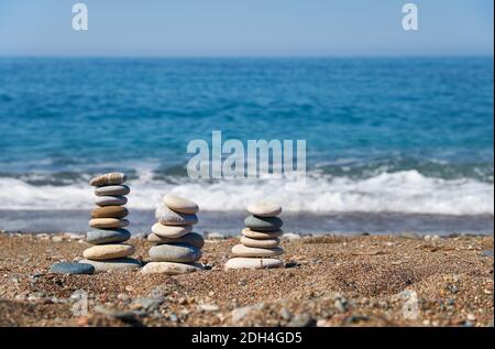 Stack of stones on Petra tou Romiou or Aphrodite Rock Beach, Cyprus Stock Photo