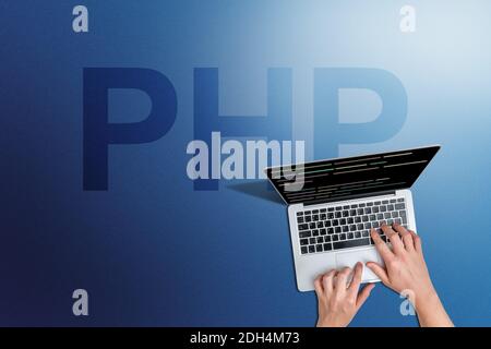 Programming language php code with person and laptop. Stock Photo