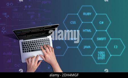 Programming languages code with person and laptop. Stock Photo
