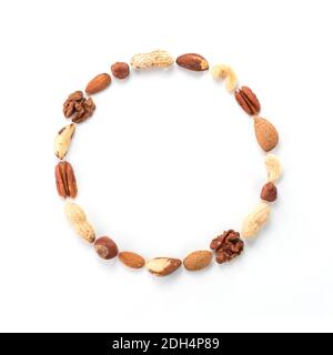 Pattern of nuts in circle form isolated on whie Stock Photo