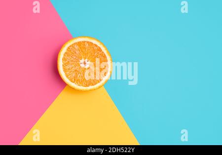 Orange on abstract geometry colored paper texture minimalism background Stock Photo